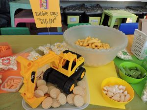 Yellow (Rubble): Flings, yellow milk bottles and vanilla Oreo cookies being picked up by 'Rubble’s' digger